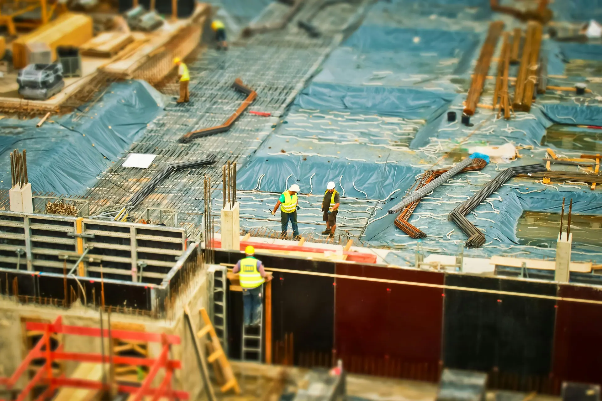 Construction team preparing structural work